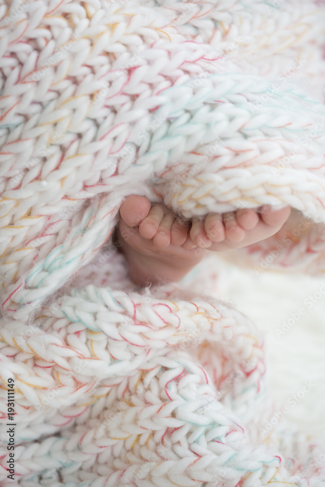 baby feet in blanket, copy space. selectiv focus baby feet in blanket, copy space. selectiv focus