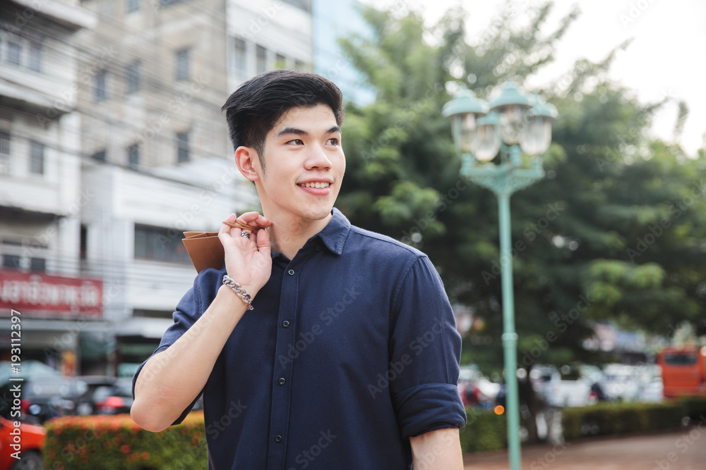 Fototapeta premium Young asian male shopping