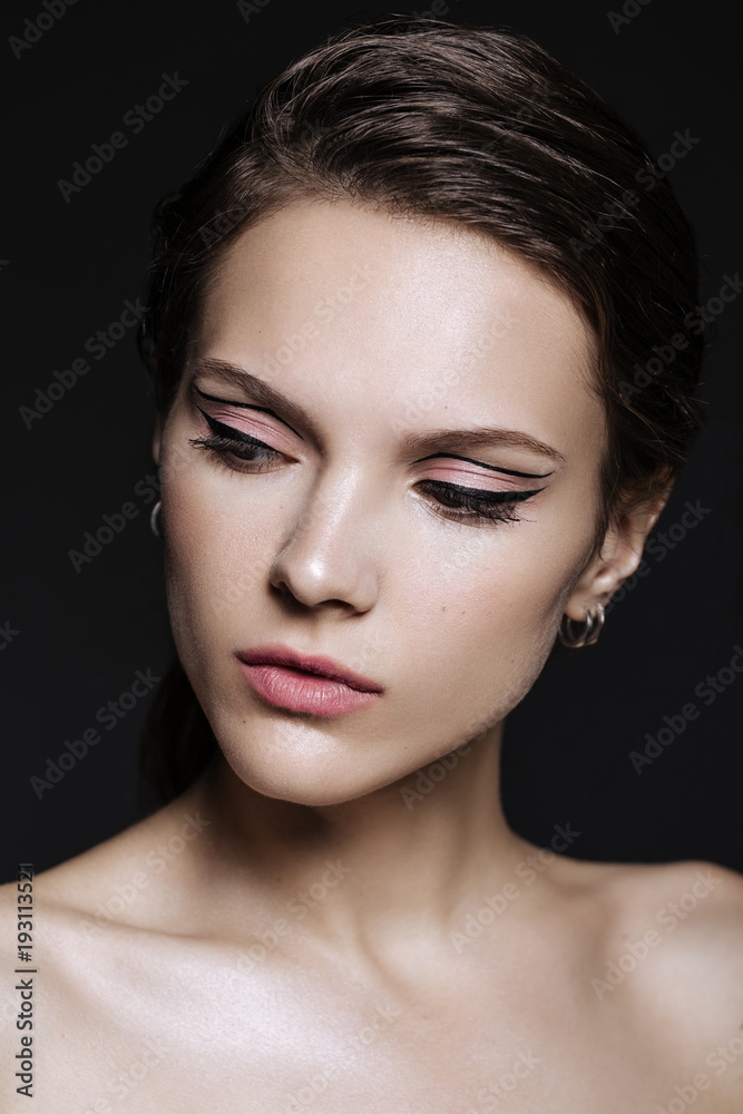 beautiful model woman with natural make-up and brunette hair studio fashion shot on black background beautiful model woman with natural make-up and brunette hair studio fashion shot on black background