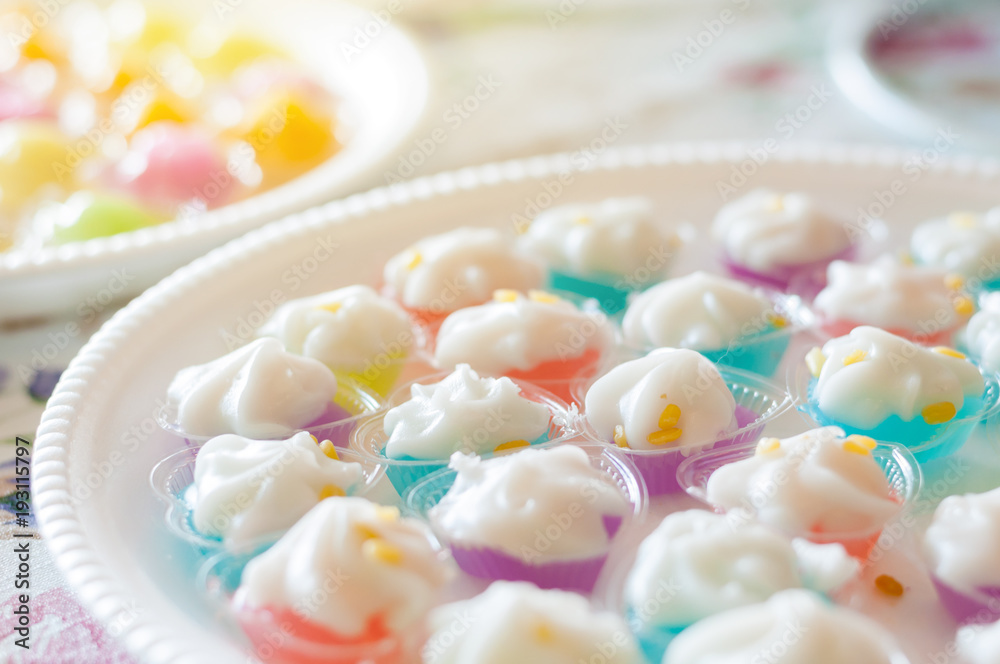 Mung Bean Flour Coconut Dessert in Jelly close up in white foam dish floral background, Leum Kleun Thai sweets Mung Bean Flour Coconut Dessert in Jelly close up in white foam dish floral background, Leum Kleun Thai sweets
