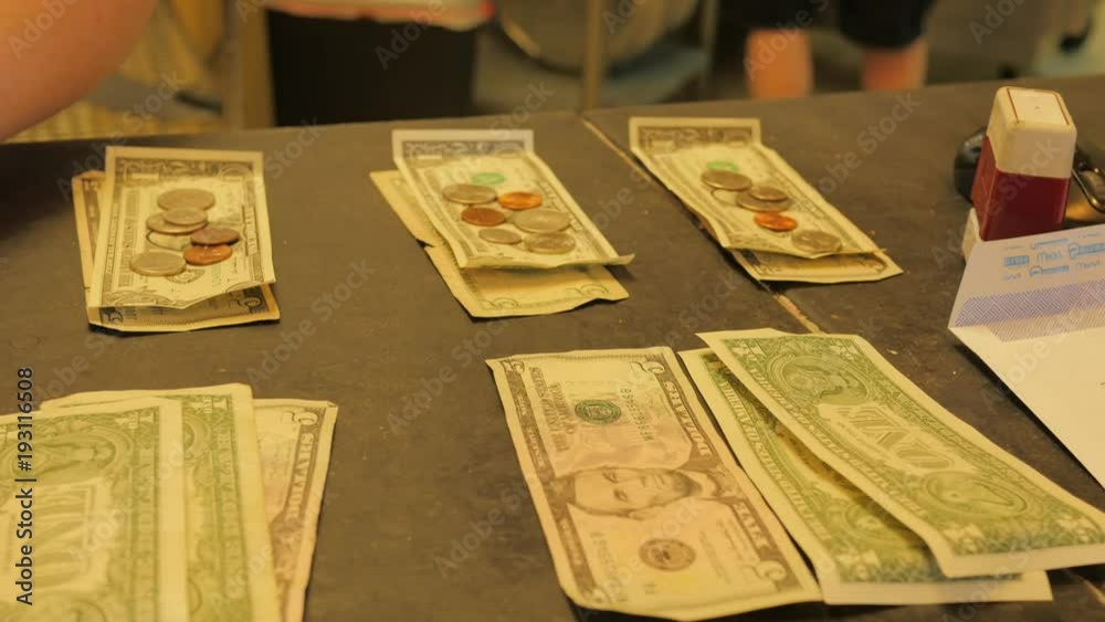 Dividing up tip money for employees at a restaurant.