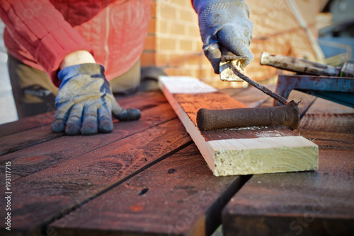 Wallpaper Mural Female hand painting wood with paint roller Torontodigital.ca