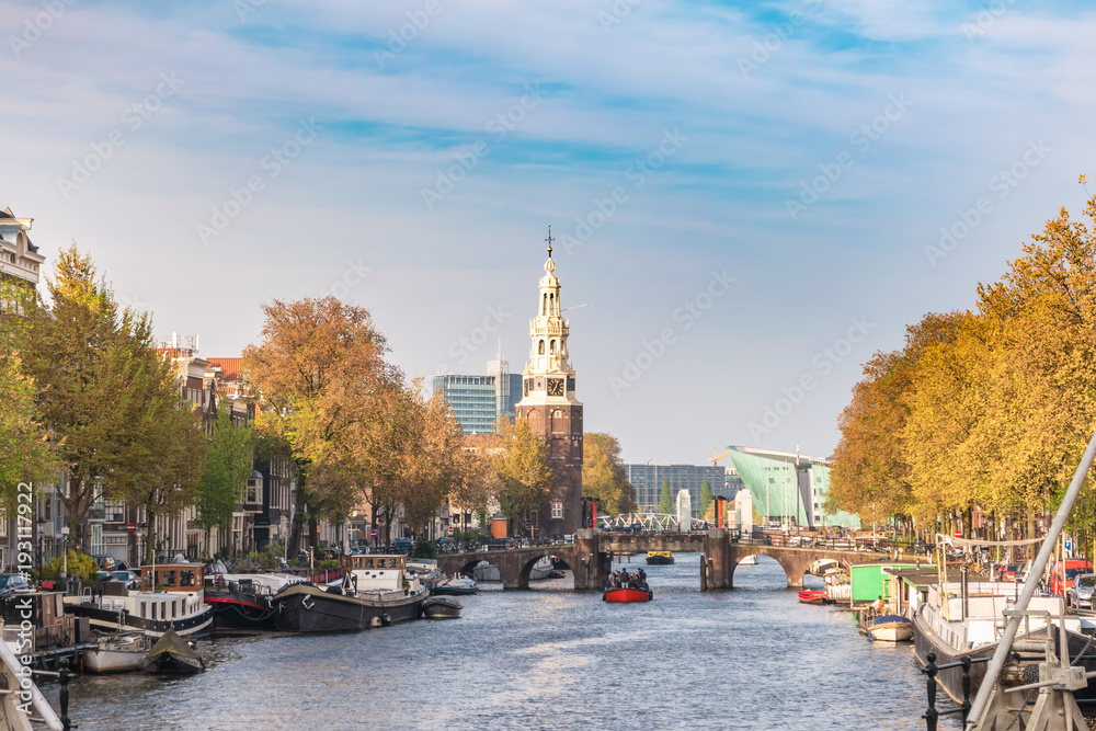 Obraz premium Amsterdam sunset city skyline at Montelbaanstoren Tower, Amsterdam, Netherlands