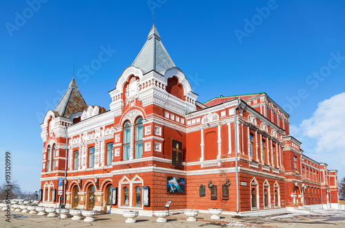 View on historic building of drama theater in sunny winter day