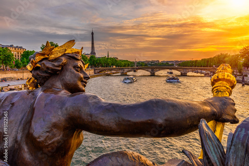The Nymph reliefs on the bridge of Alexander III with the Eiffel Tower on background at sunset in Paris, France © Ekaterina Belova