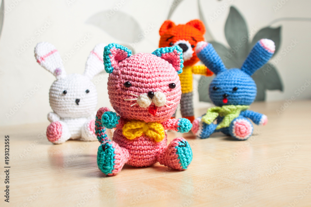 Fototapeta premium knitted toy cat, bear, rabbit, hare, handmade