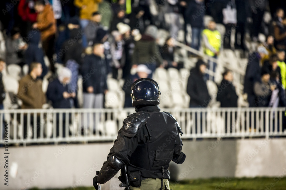 Obraz premium The police at the stadium event secure a safe match against the hooligans