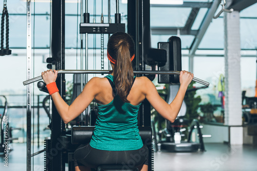 sporty woman working out on training apparatus