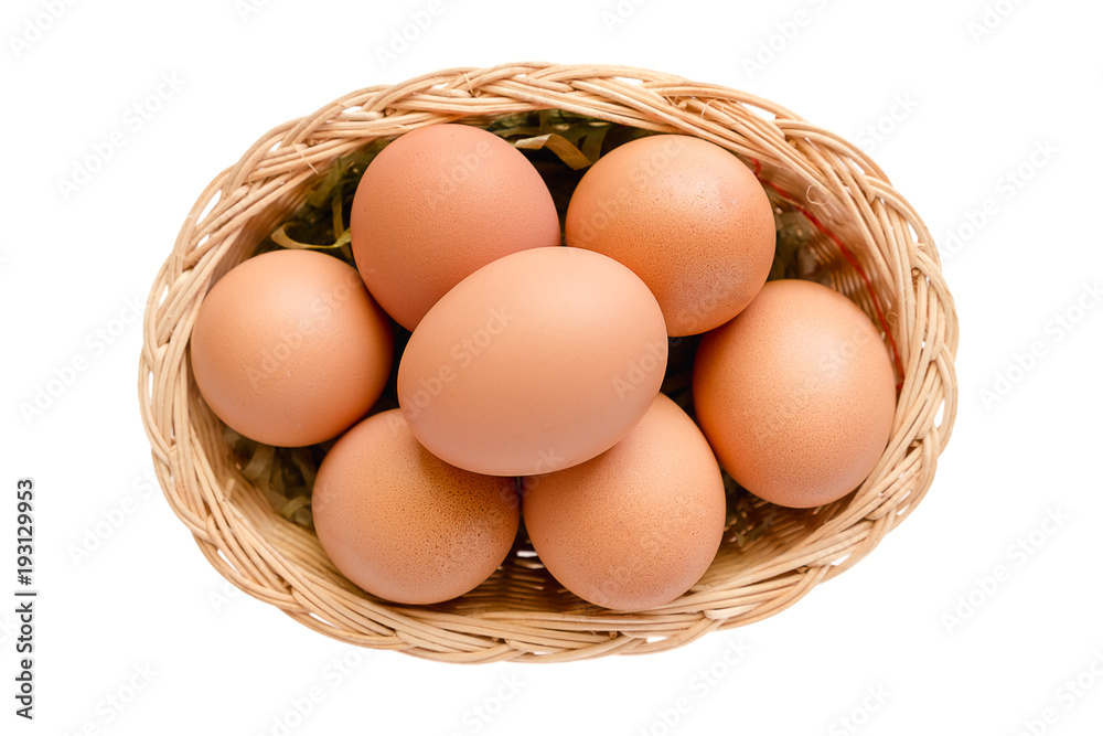 Eggs in the wicker basket on white background Eggs in the wicker basket on white background