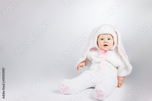 little cute baby in a white Bunny suit.