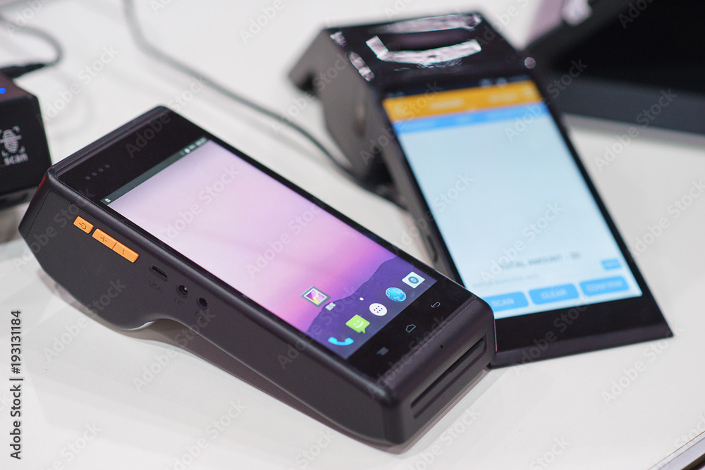 modern wireless terminal for payment with a touch screen. modern wireless terminal for payment with a touch screen.