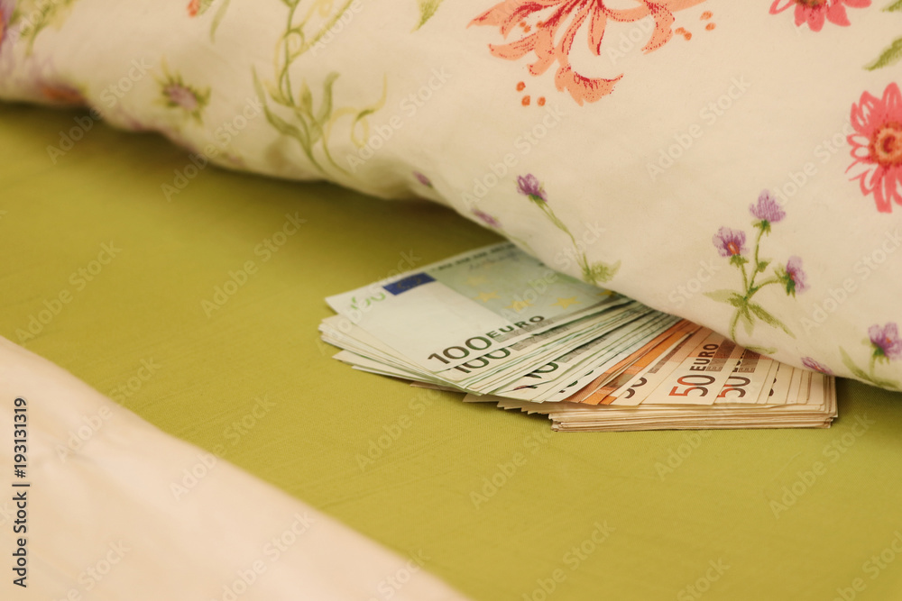 Fotografie Hide money under the pillow