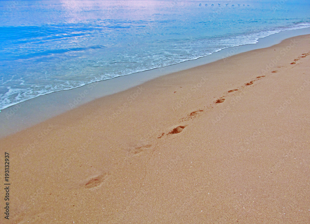 Abstract human footprints on sand beach.
View of the sand and water on the beach in Miami, Florida, USA.Travel vacation concept. Abstract human footprints on sand beach.
View of the sand and water on the beach in Miami, Florida, USA.Travel vacation concept.