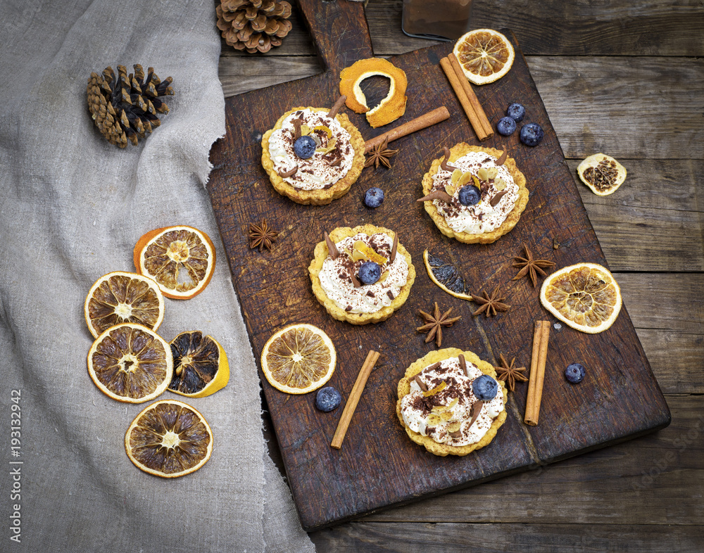 sweet cakes with white cream and chocolate powder sweet cakes with white cream and chocolate powder