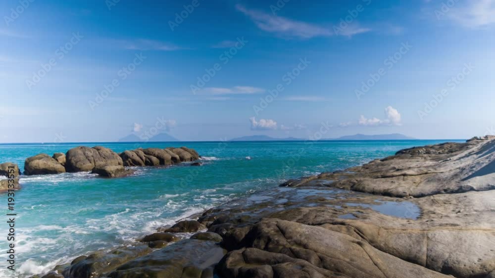 a pebble beach and Mediterranean sea with the Aeolian islands in the distance in Sicily, Italy. a pebble beach and Mediterranean sea with the Aeolian islands in the distance in Sicily, Italy.