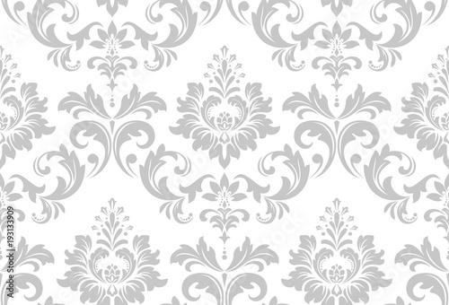 Wallpaper in the style of Baroque. A seamless vector background. White and grey floral ornament. Graphic vector pattern.