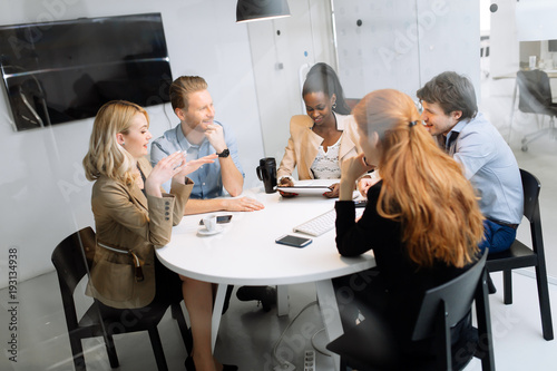 Group of business people sitting at desk