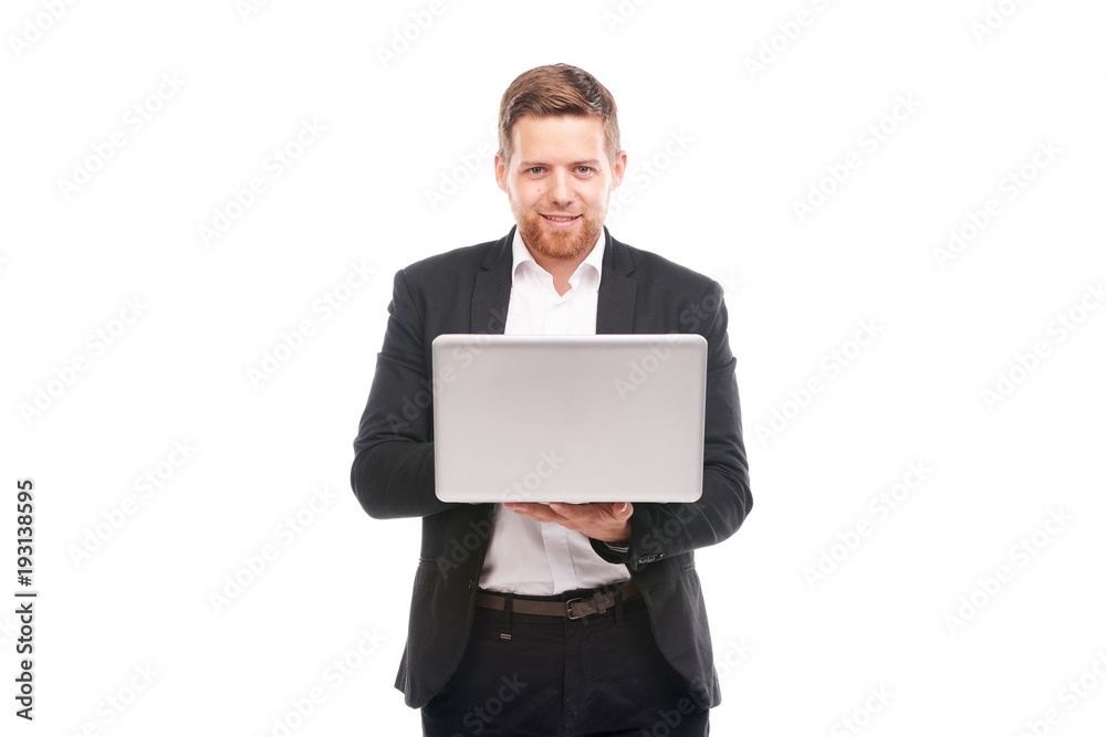 Studio portrait of young manager in suit holding open laptop Studio portrait of young manager in suit holding open laptop
