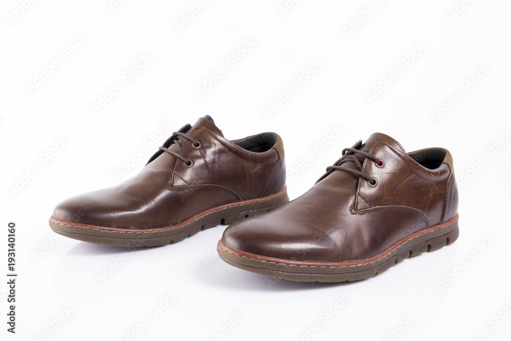 Male brown leather shoe on white background, isolated product, comfortable footwear.