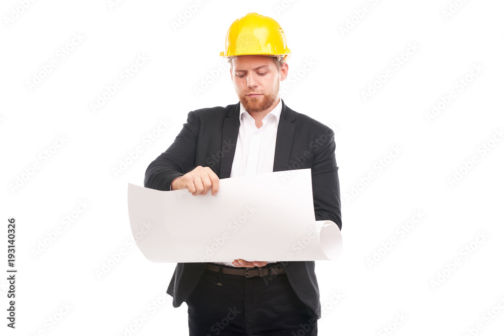 Portrait of architect wearing suit and yellow hardhat holding project plan on white background Portrait of architect wearing suit and yellow hardhat holding project plan on white background