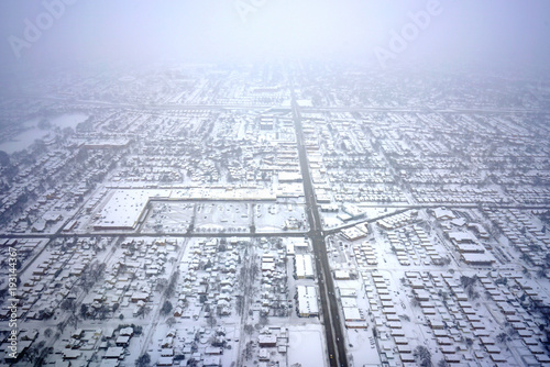 Aerial view of the Chicago suburbs covered with snow after a winter storm near O'Hare airport (ORD) photo