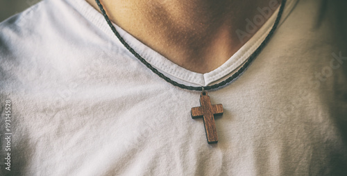 Photography The wooden cross necklace on man's neck