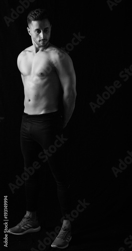 Fitness session in madrid's photographic studio with a boy without a shirt