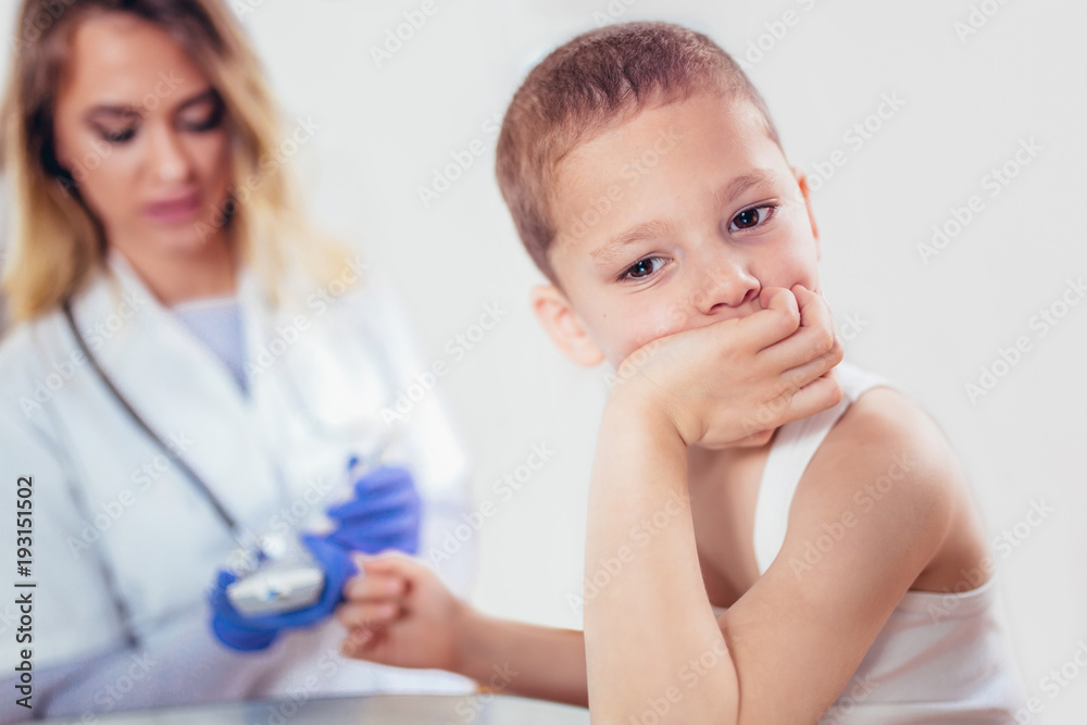 Measure child glucose level blood test diabetes little boy using glucometer, medicine, healthcare, pediatry and people concept Measure child glucose level blood test diabetes little boy using glucometer, medicine, healthcare, pediatry and people concept