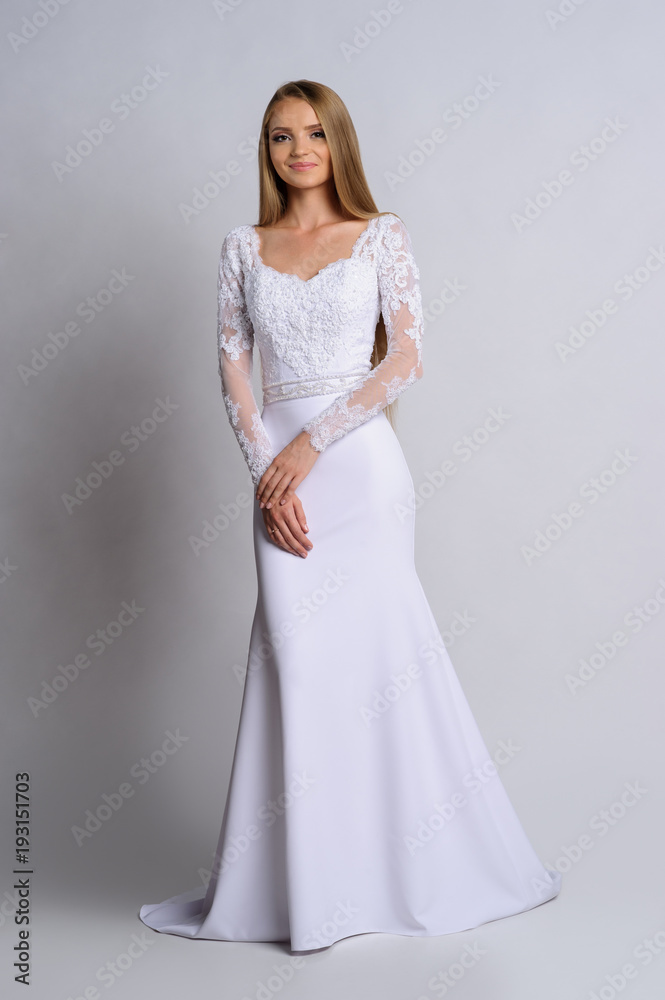 Beautiful bride in wedding dress, white background