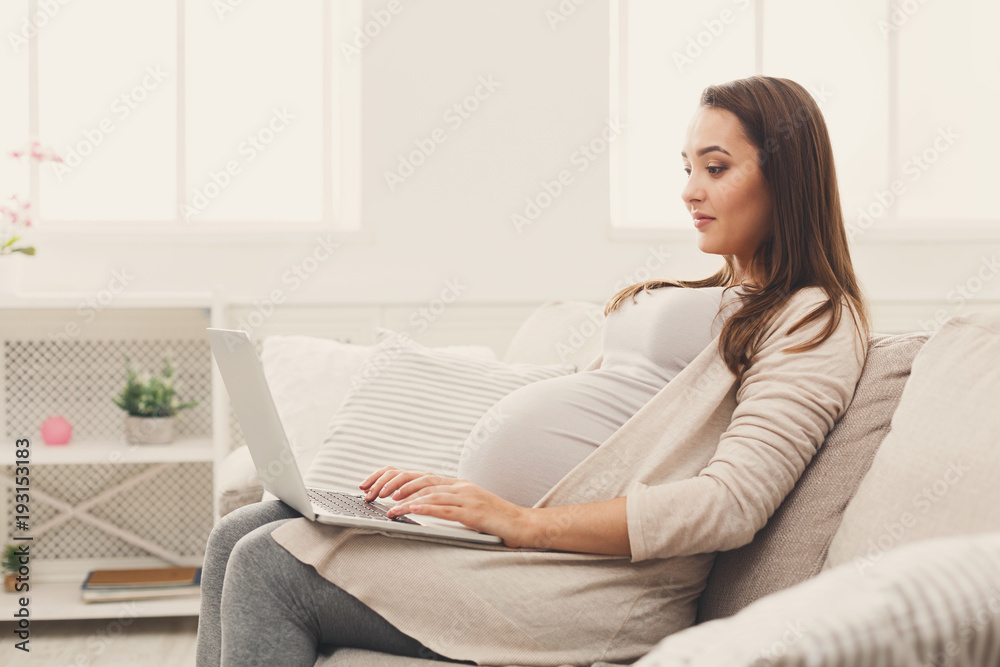 Pregnant business woman remote working at home Pregnant business woman remote working at home