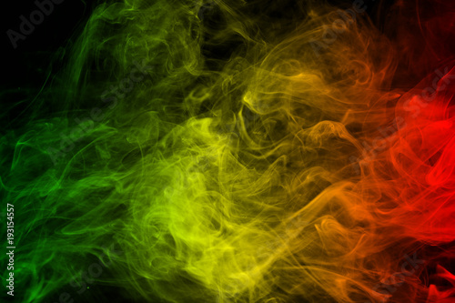 abstract background smoke curves and wave reggae colors green, yellow, red colored in flag of reggae music