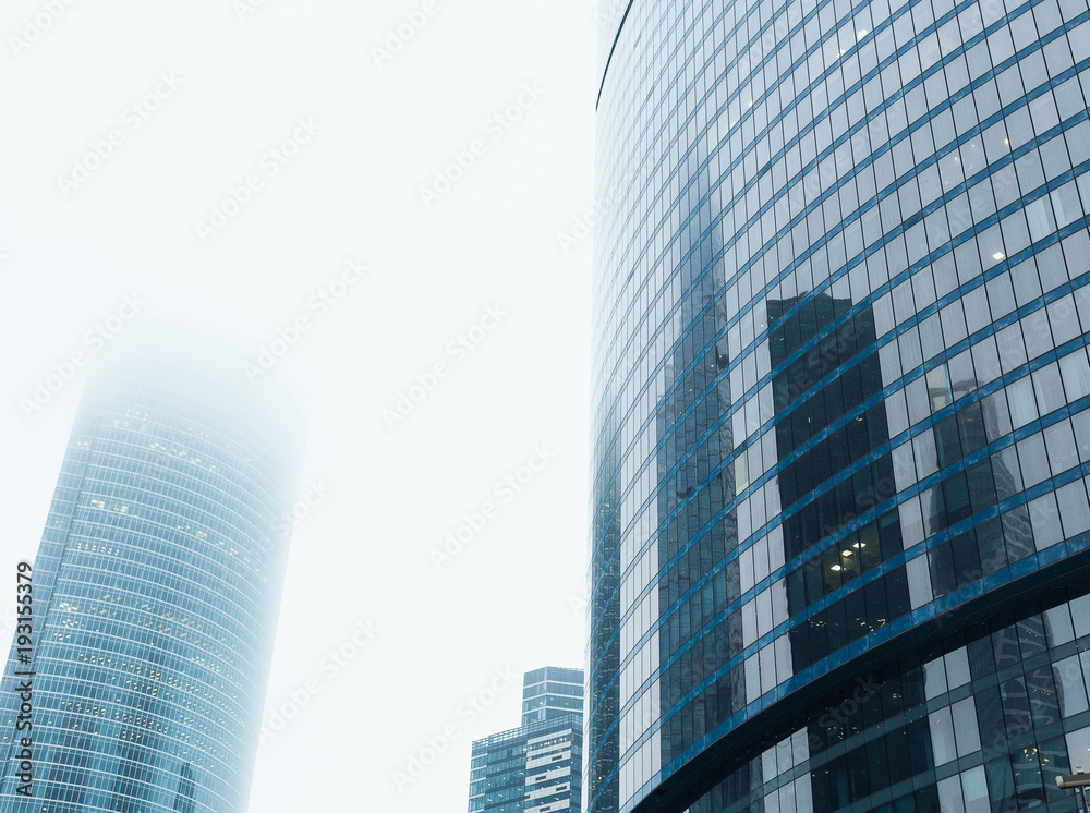 Glass facades of modern skyscrapers at business district