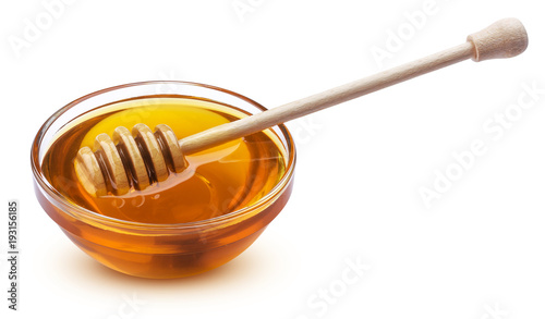 Bowl of honey isolated on white background
