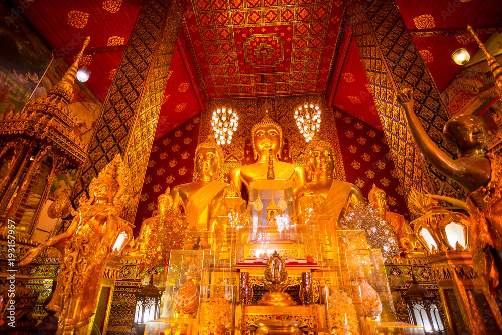 Most beautiful group of Thai golden buddha statue at Wat Phra That Hariphunchai Buddhist temple (wat) in Lamphun Thailand.