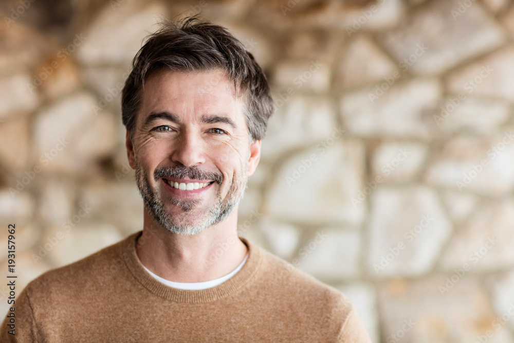 Portrait Of A Mature Man Smiling At The Camera. Home Portrait Of A Mature Man Smiling At The Camera. Home