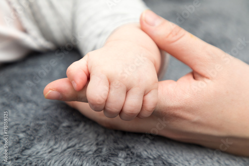 baby hand with mother hand