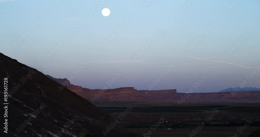 Mountain biker in scenic Utah during moonscape Mountain biker in scenic Utah during moonscape