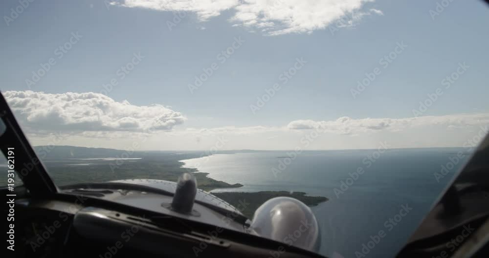 Cockpit POV, plane flies over vast lake landscape Cockpit POV, plane flies over vast lake landscape