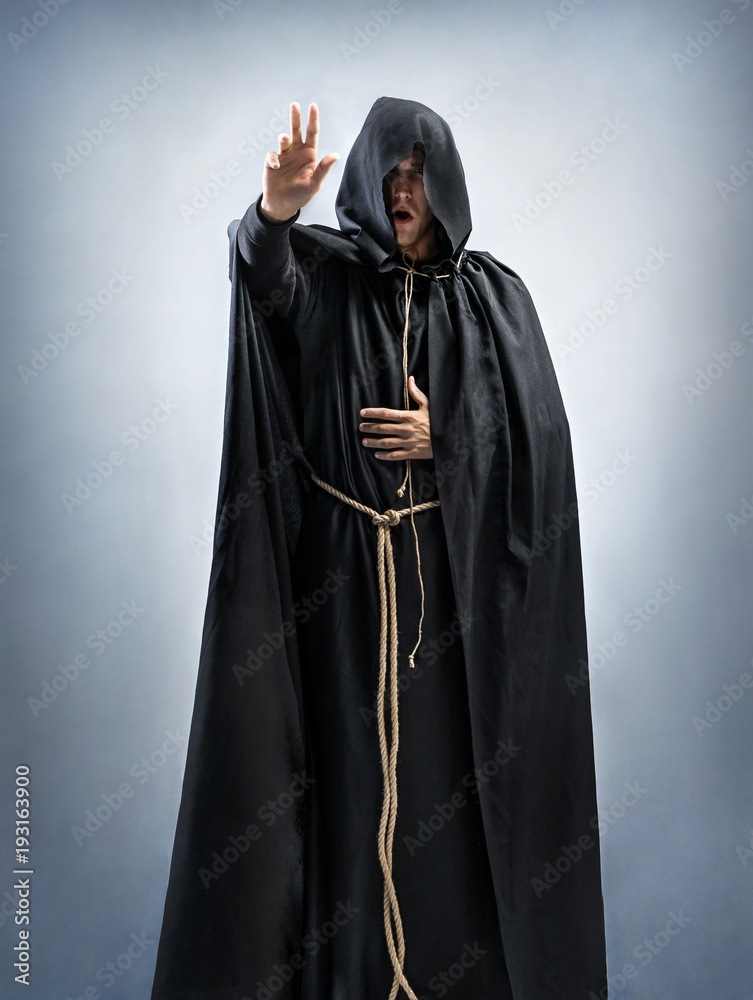 Monk preaches or reads a prayer. Portrait of a man wearing a monk robe.  Full height. Concept for faith, spirituality and religion Photos | Adobe  Stock