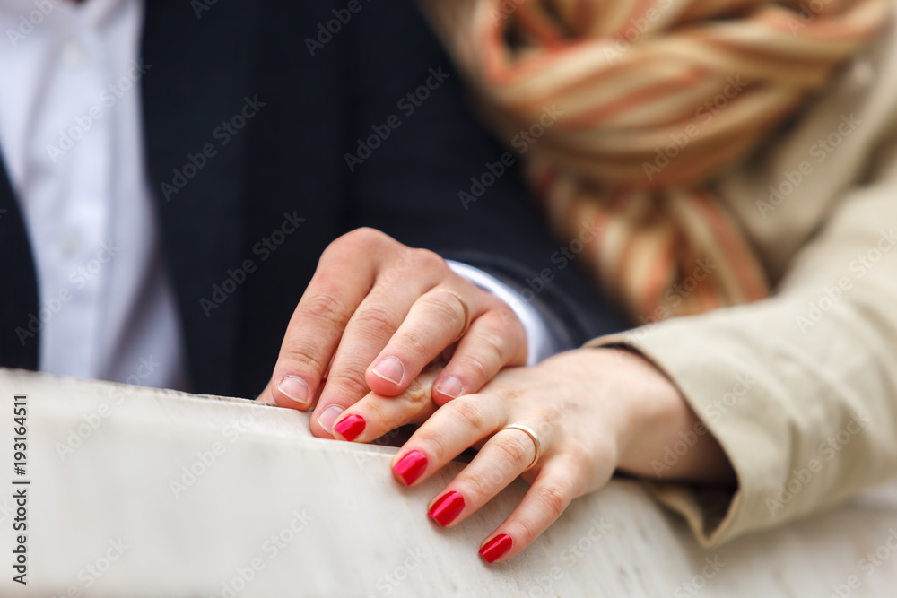Man and woman holding each other's hands Man and woman holding each other's hands