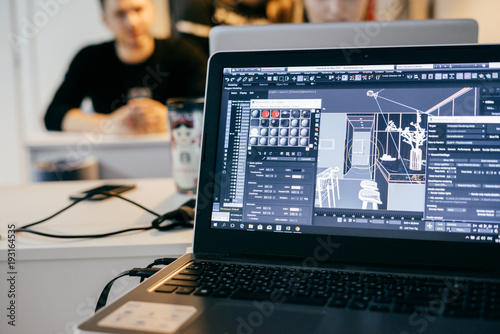 People in the office designer architects working on a project on laptops
