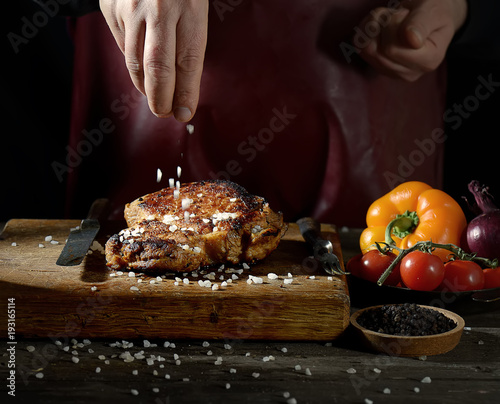 man salt fried steak photo