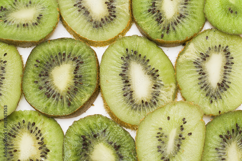 The cut kiwi fruit. Close-up background texture The cut kiwi fruit. Close-up background texture