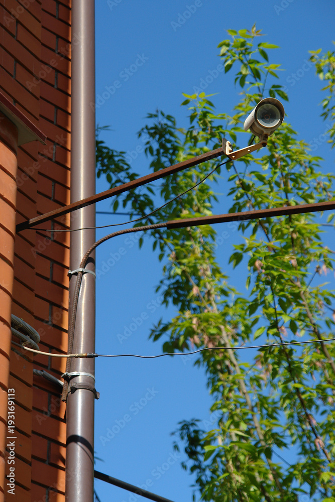 Fototapeta premium CCTV security camera on the wall outside.