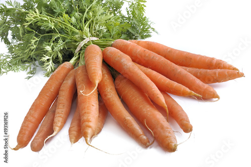 close on bunch of fresh carrots isolated on white background 