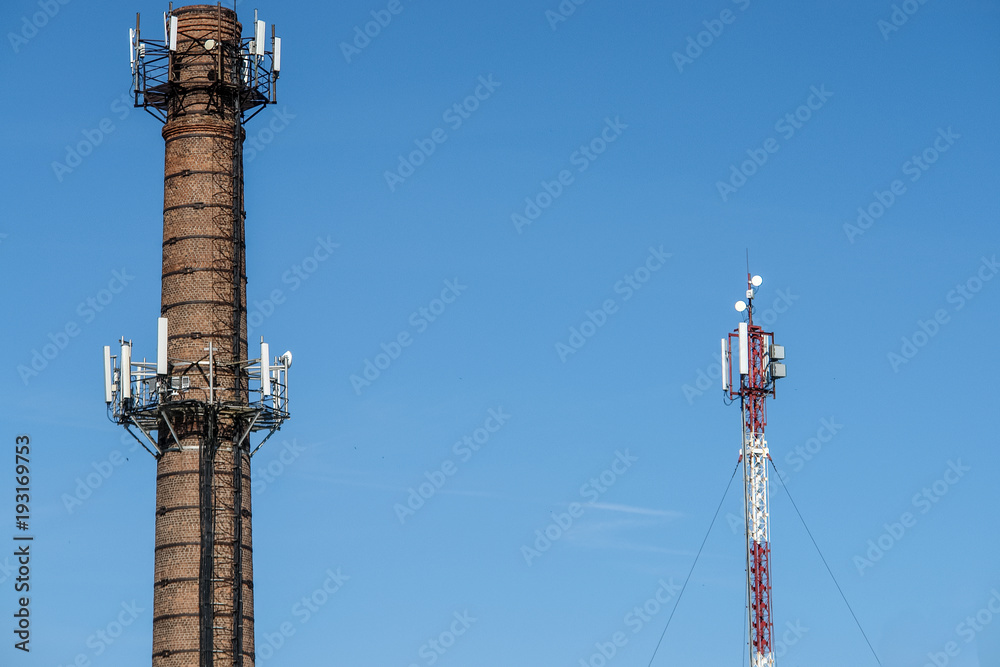 Old brick chimney turn into cellular tower. Old brick chimney turn into cellular tower.