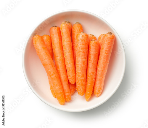 Baby Carrots in Bowl Isolated on White Background photo