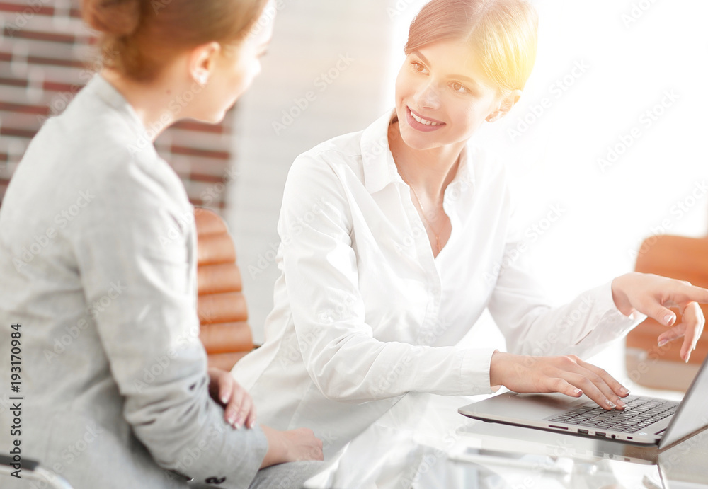 woman Manager shows the client information on the laptop. woman Manager shows the client information on the laptop.