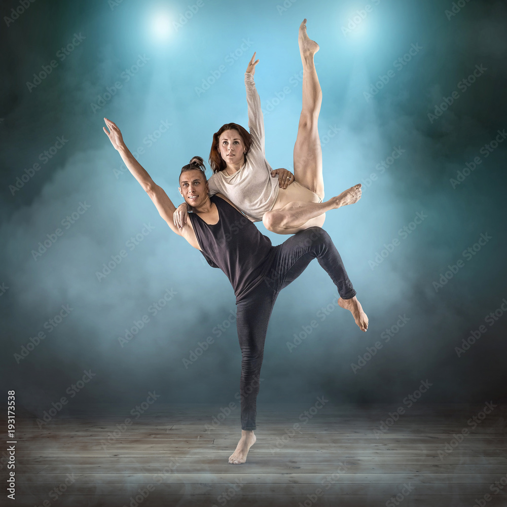 Two person, dancers, woman and man in dynamic action figure pose