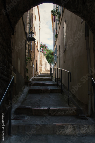 Dark mediterranean staircase, alley in Antibes, Cote d'Azur